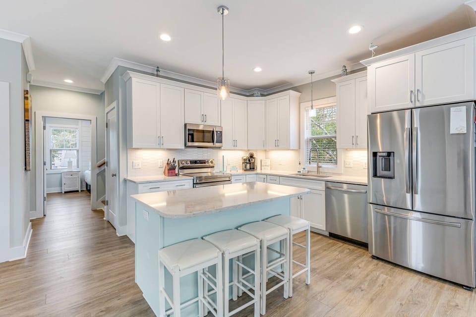 Kitchen area with a spacious island that seats four.