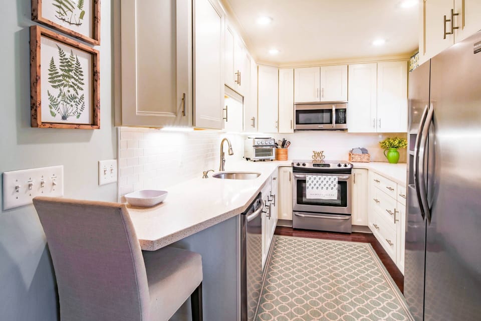 There is plenty room in this bright & cheery kitchen to prepare your family's meals.