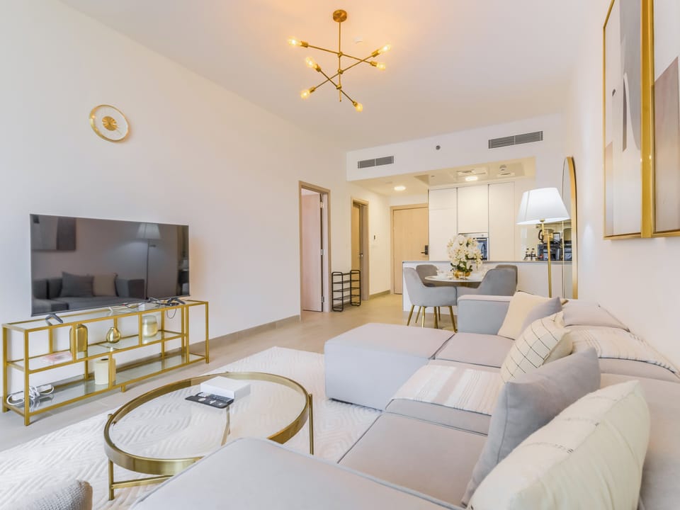 Deluxe Apartment, Balcony, City View | Living area | 55-inch Smart TV with digital channels