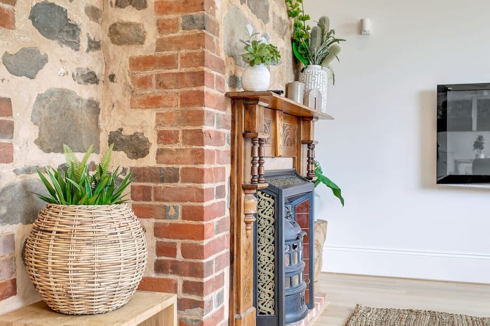 Heritage details like this non-functional original fireplace add a touch of charm to your stay.