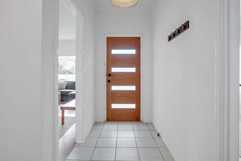 A light-filled entrance leads into your relaxed beachside stay.