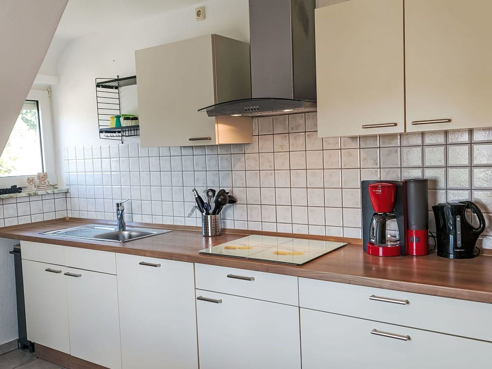 Kitchen, Countertop, Interior Design, Flooring, Kitchen Appliance, Cabinetry, Kitchen Sink, Furniture, Lighting, Floor