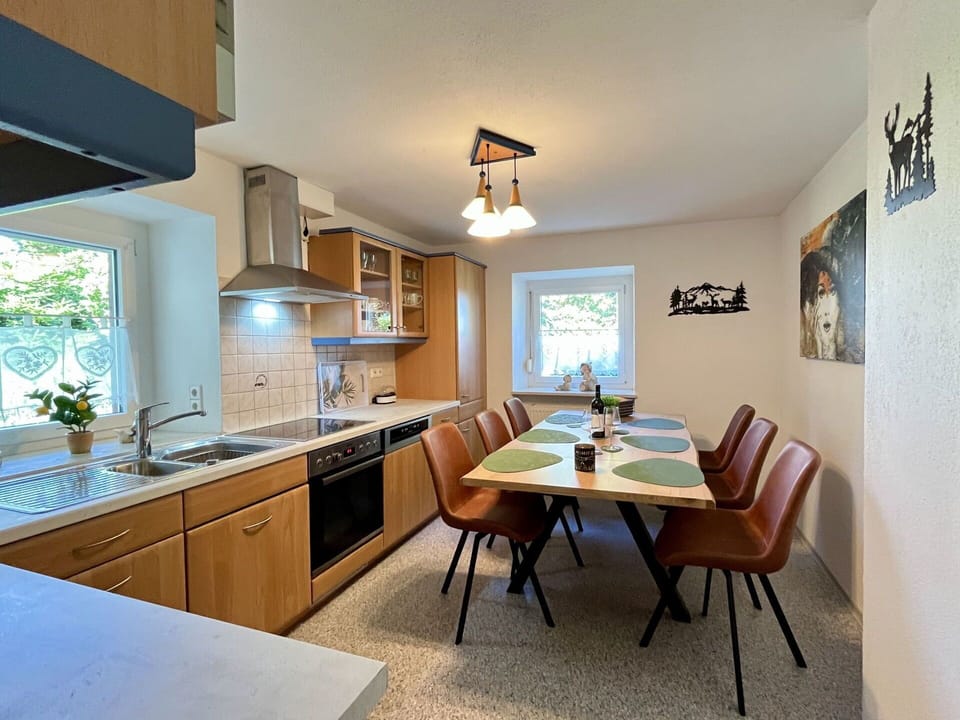 Furniture, Interior Design, Wood, Ceiling, Flooring, Light Fixture, Kitchen & Dining Room Table, Kitchen, Countertop, Lighting
