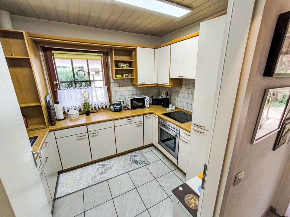 Kitchen, Wood, Countertop, Kitchen Appliance, Flooring, Cabinetry, Interior Design, Major Appliance, Floor, Furniture