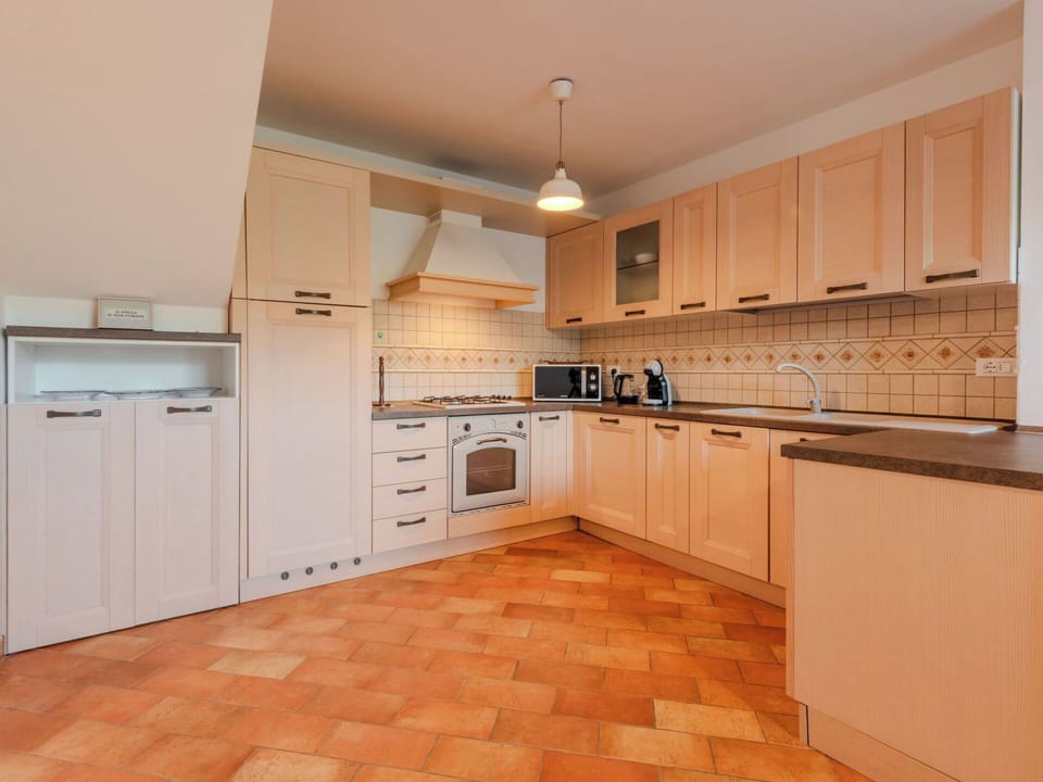 Kitchen, Countertop, Cabinetry, Kitchen Appliance, Flooring, Interior Design, Floor, Wood, Major Appliance, Ceiling