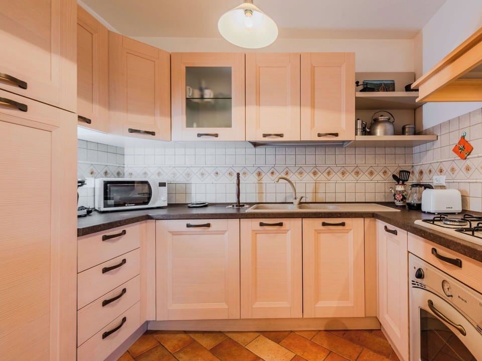 Kitchen, Kitchen Appliance, Countertop, Cabinetry, Major Appliance, Wood, Interior Design, Stove, Flooring, Kitchen Sink