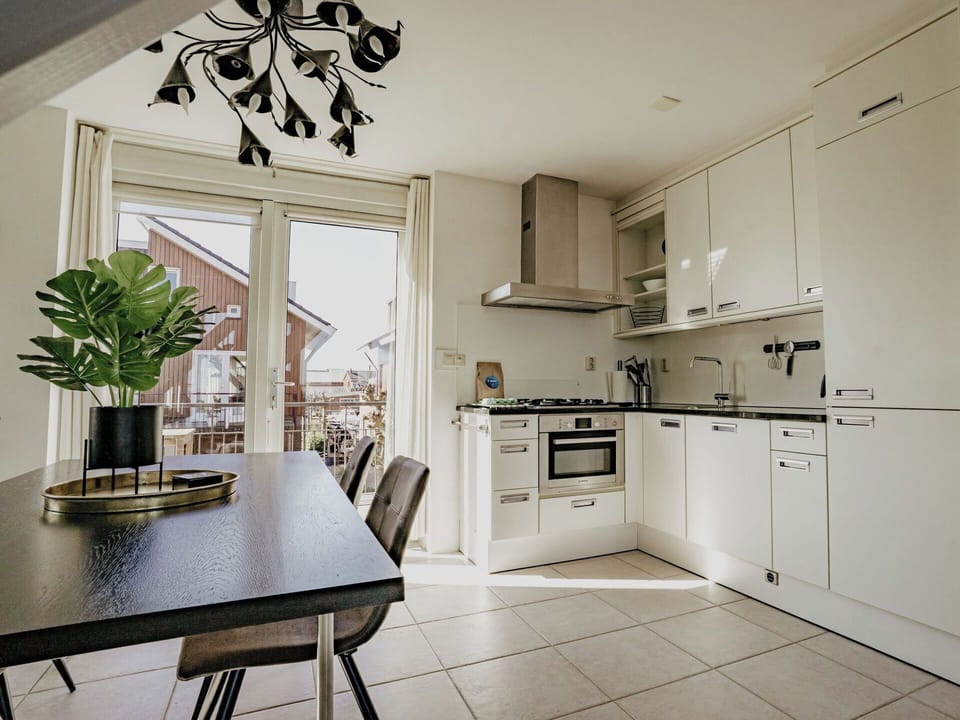 Kitchen, Kitchen Appliance, Interior Design, Furniture, Countertop, Flooring, Cabinetry, Floor, Wood, Ceiling