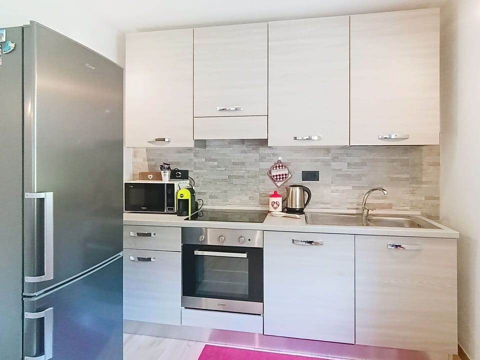 Kitchen Appliance, Kitchen, Countertop, Cabinetry, Major Appliance, Furniture, Home Appliance, Flooring, Interior Design, Wood