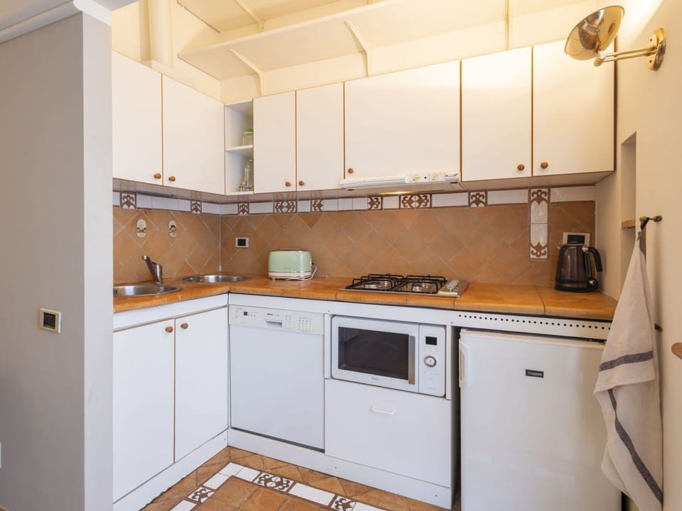 Kitchen, Kitchen Appliance, Countertop, Major Appliance, Cabinetry, Wood, Flooring, Kitchen Sink, Kitchen Stove, Interior Design