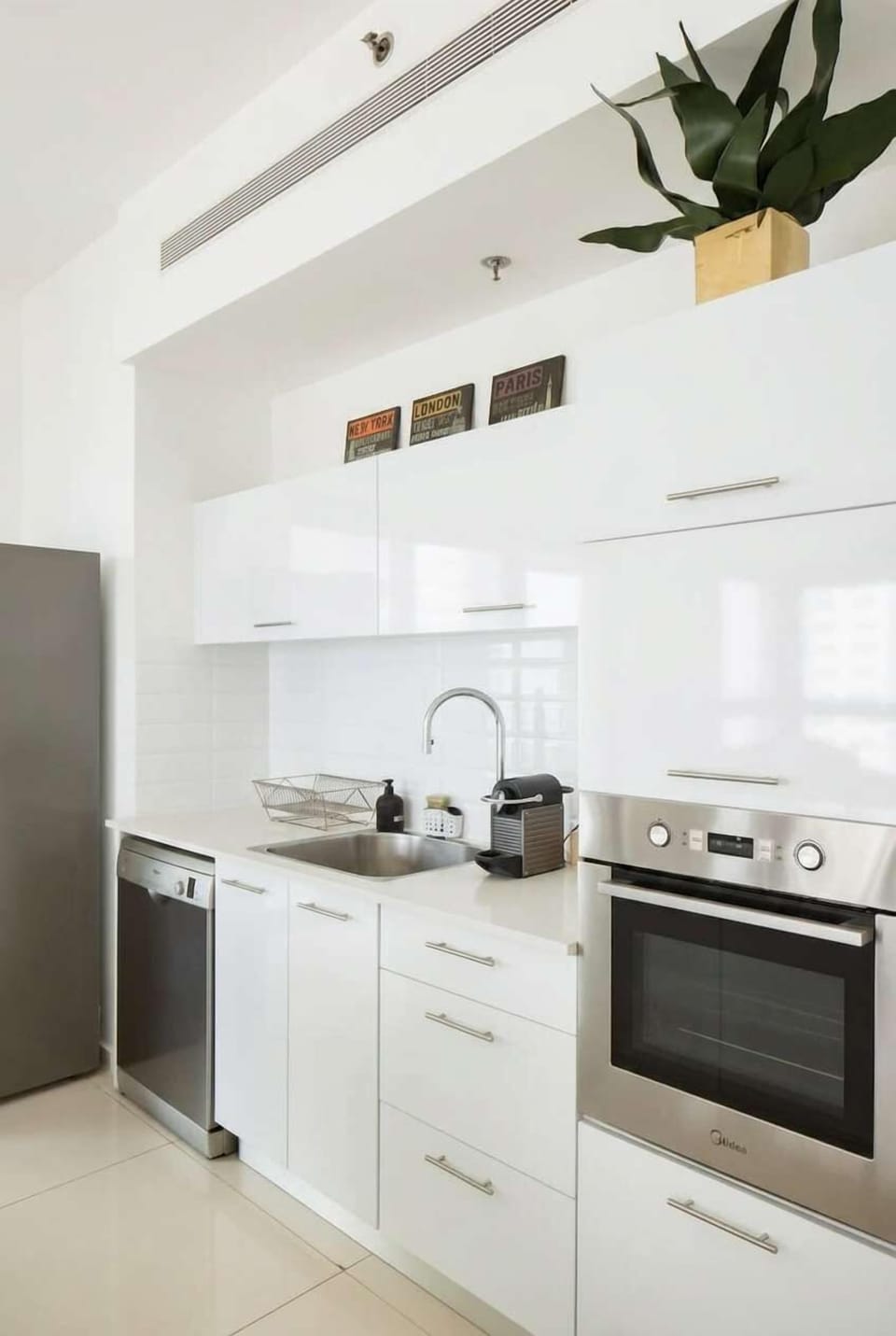 Clean kitchen layout offers everything needed for cooking during comfortable extended stays.