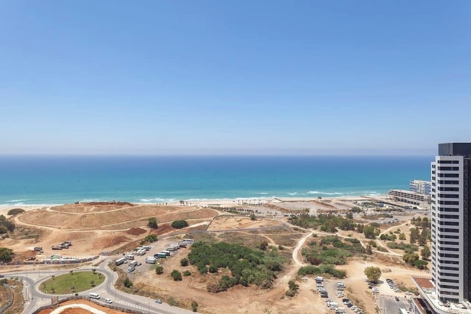 High-floor view showcases the coastline, offering stunning scenery from the comfort of your apartment.