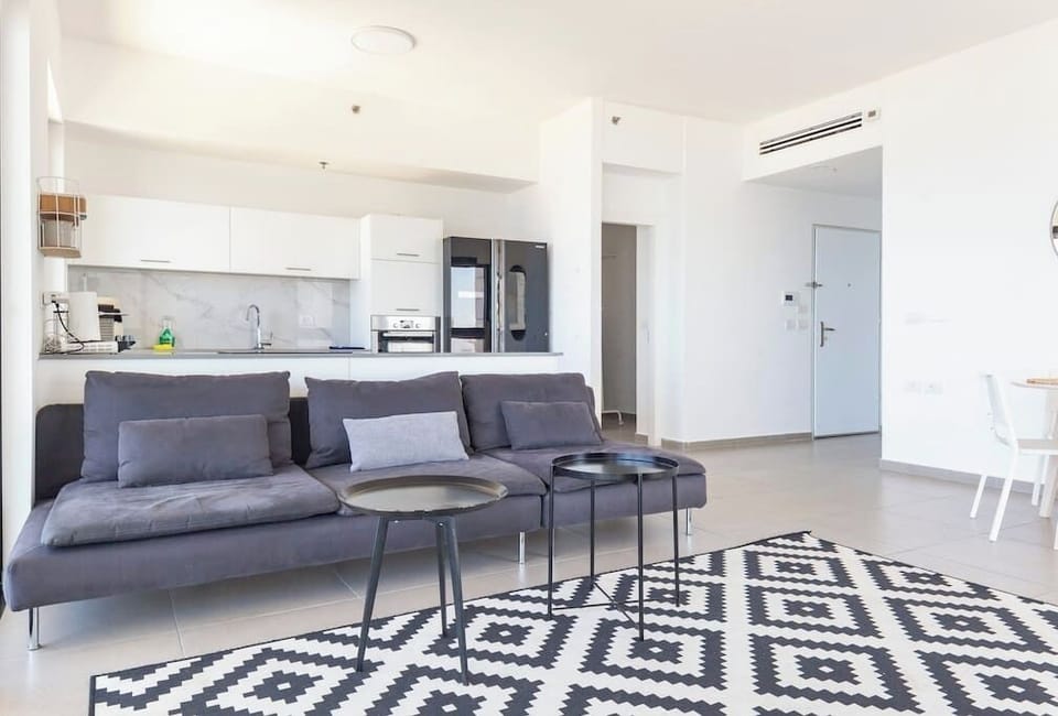 Spacious lounge area blends comfort and style, perfect for gathering with family or friends.