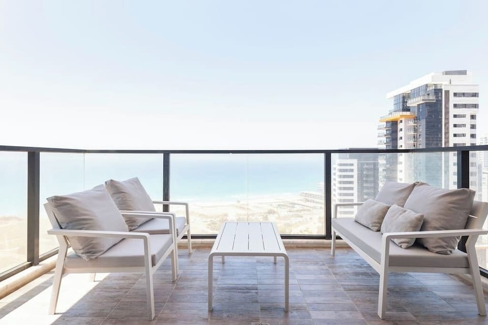 Balcony seating offers uninterrupted ocean views, perfect for morning coffee or sunset relaxation outdoors.
