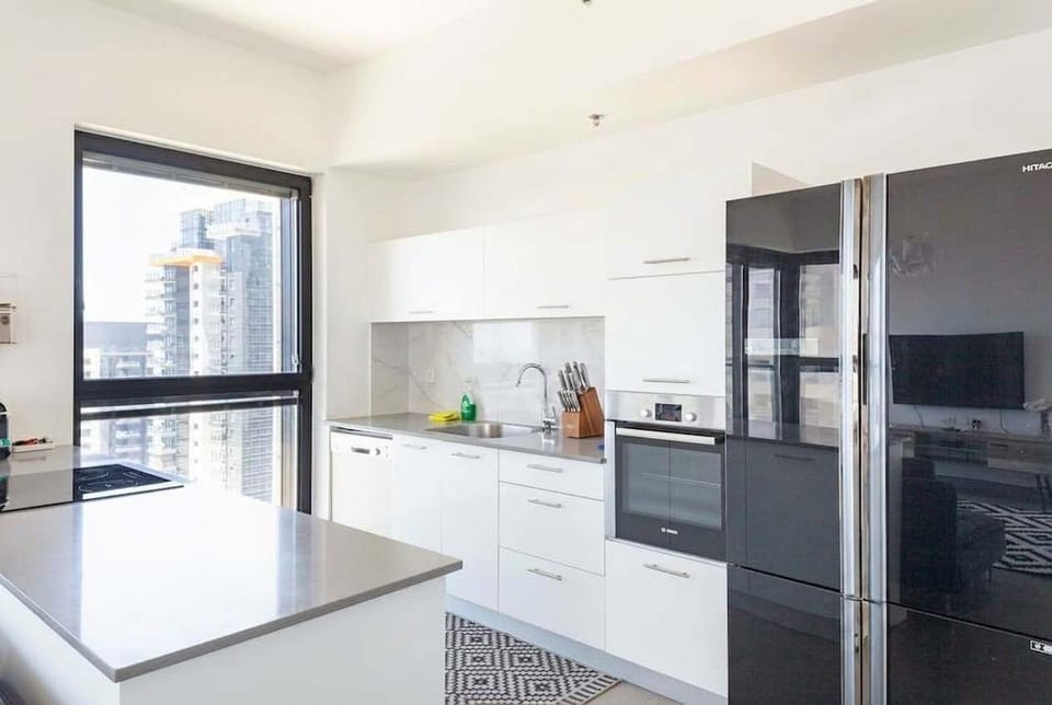 Bright kitchen with island seating makes everyday meals simple before heading out to explore.