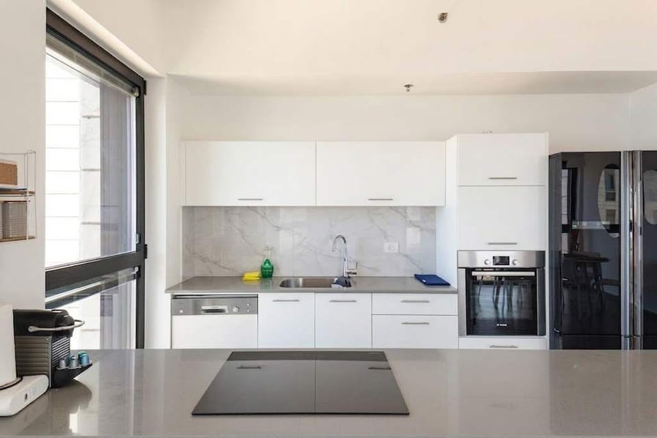 Fully equipped kitchen makes cooking easy, ideal for longer stays near shops and local conveniences.