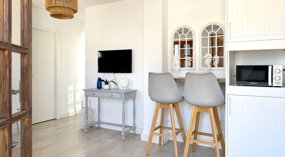 Deluxe Apartment, Sea View | Living area | TV