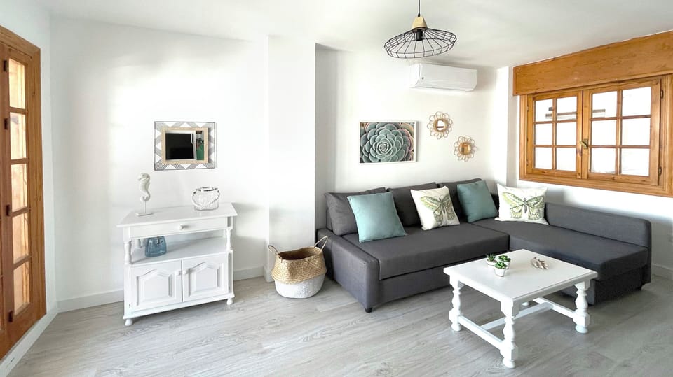 Superior Apartment, Sea View | Living area | TV