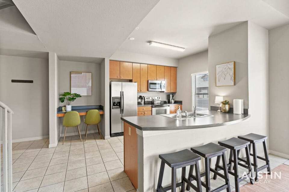 Fully stocked kitchen with dishwasher and laptop-friendly workspace