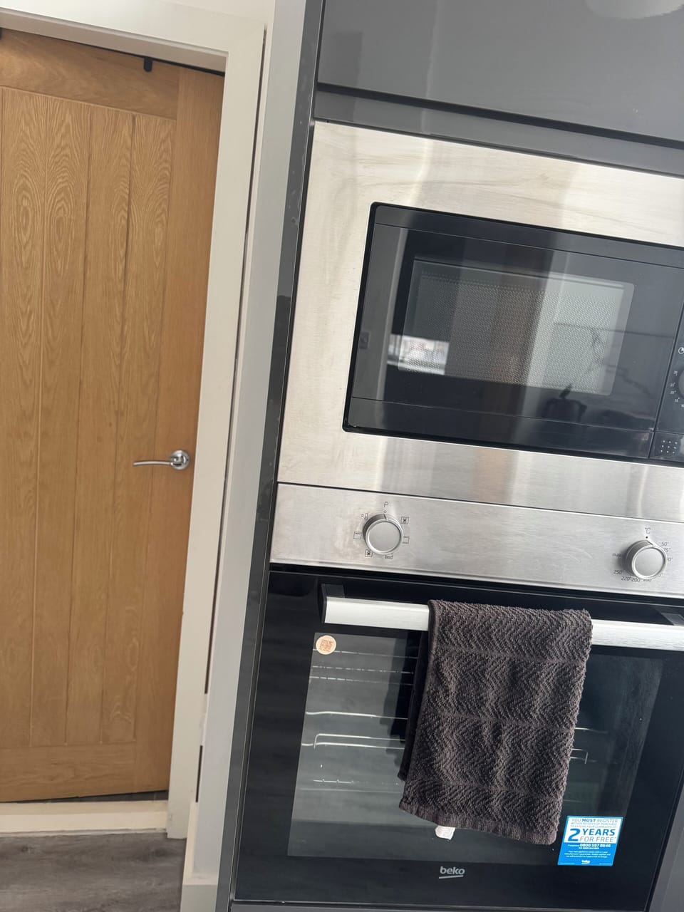 Microwave and oven in kitchen area