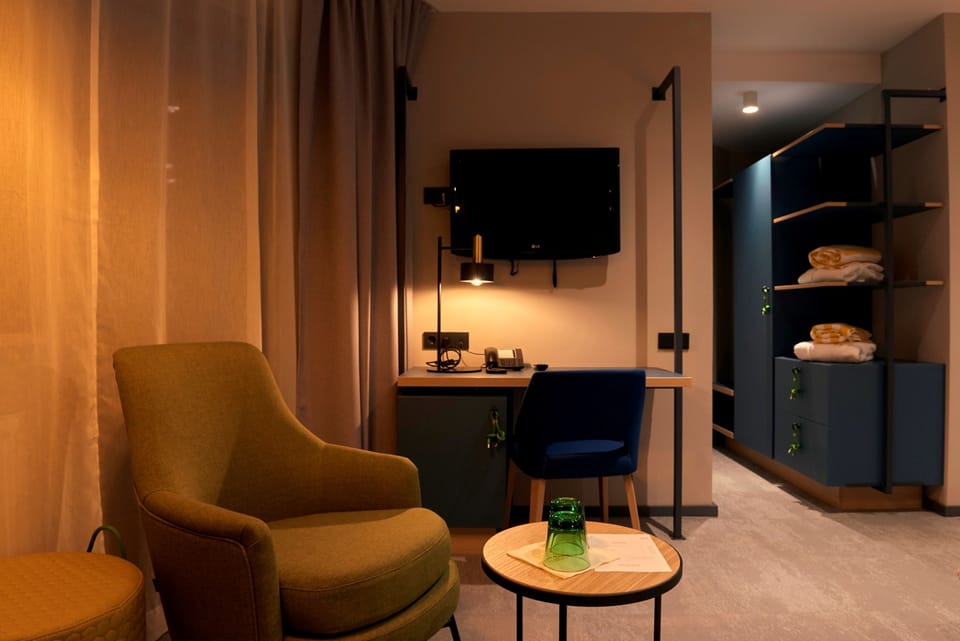 Superior Triple Room | Living area | Flat-screen TV, iPad