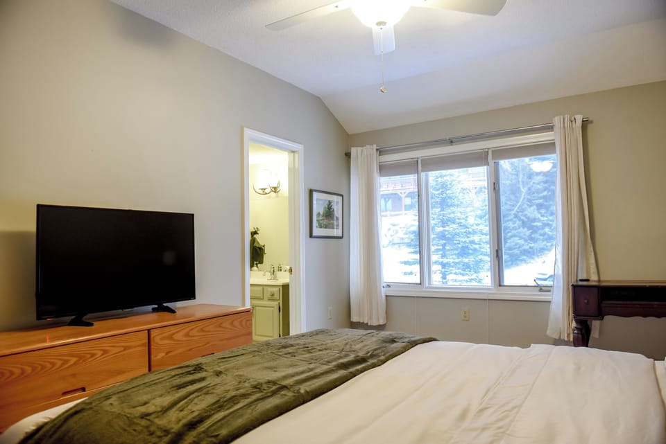 Upstairs queen bedroom (#2) with full en-suite bathroom.