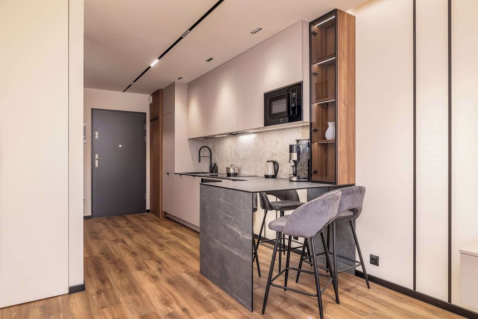 The living area's modern and stylish decor creates a welcoming atmosphere.