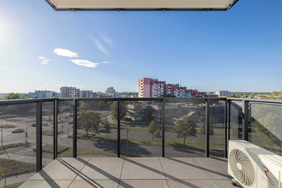 The balcony provides a perfect spot for enjoying the fresh air.