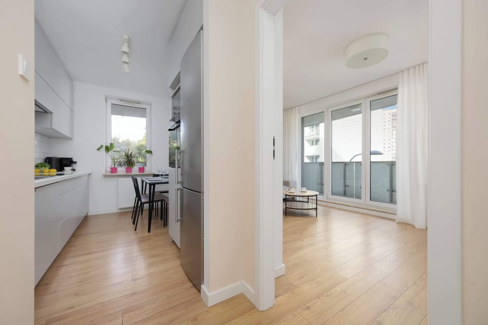 The apartment’s open space leading to the balcony allows you to enjoy natural light and a seamless flow between indoors and outdoors.