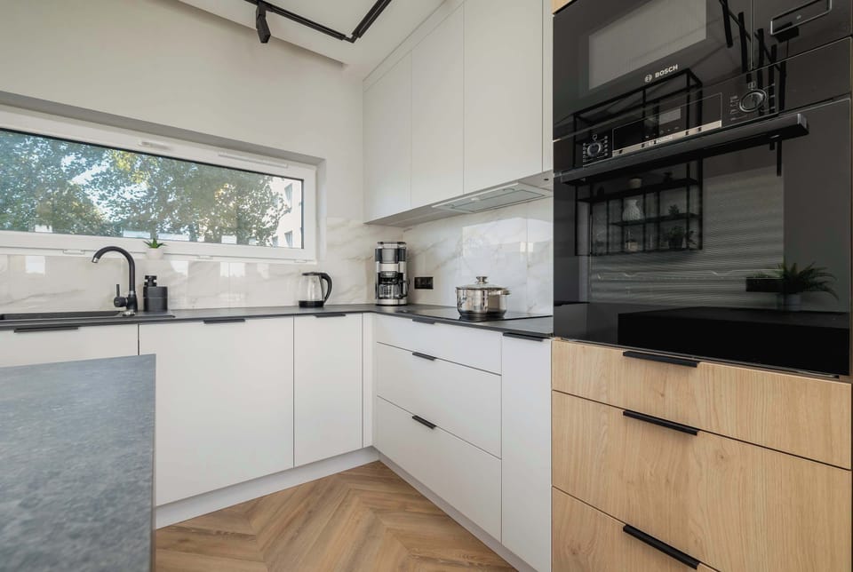 Cook and dine in style with the modern kitchenette and dining area.