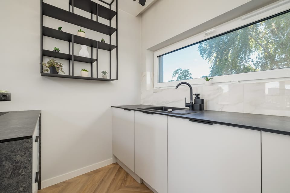 Bright and functional kitchenette with modern appliances.