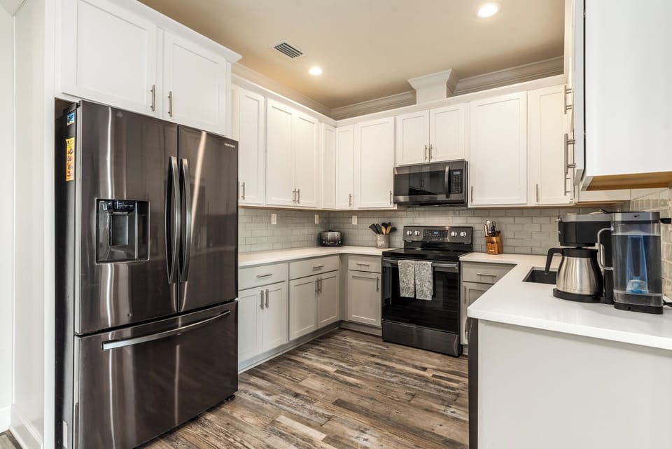 Coastal Château Modern Kitchen with Stainless Appliances