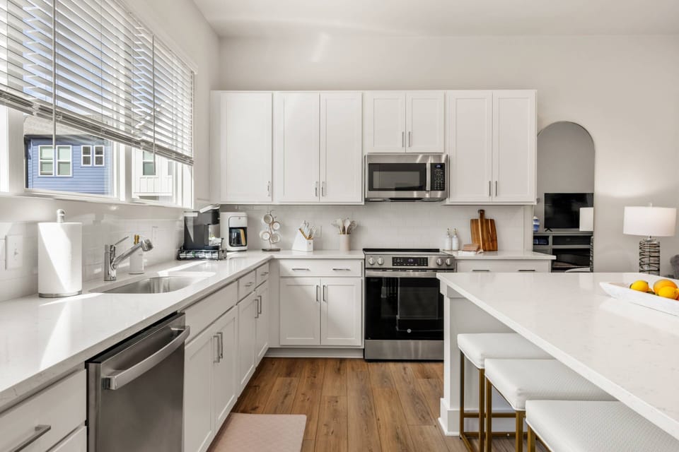 Chef-Inspired Kitchen | Fully Equipped Atlanta Vacation Rental Cook with ease using modern appliances, sleek cabinets & open counter space.