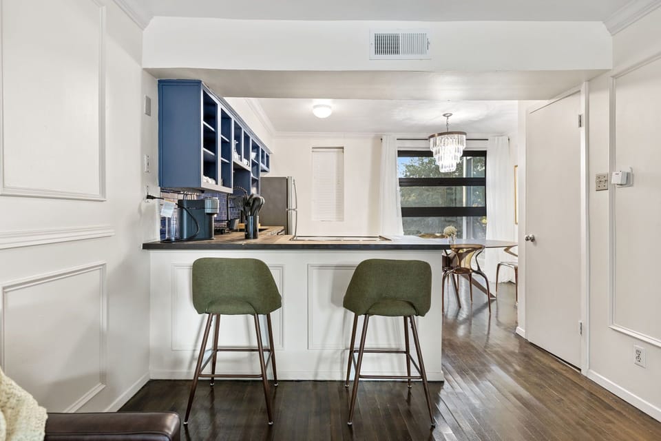 Spacious kitchen with sleek, modern appliances, with breakfast counter , fully equipped for all your cooking and dining needs
