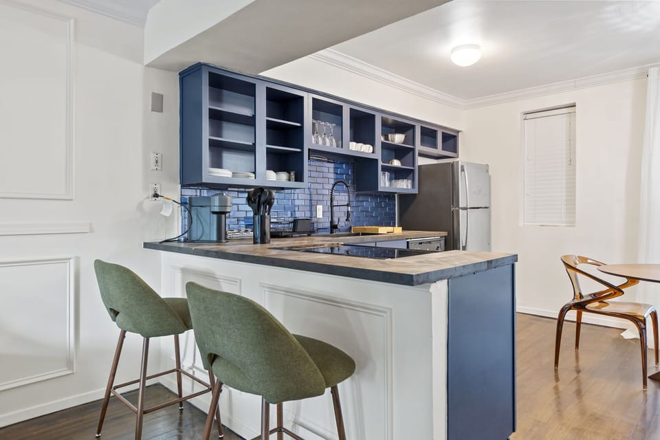 Spacious kitchen with sleek, modern appliances, with breakfast counter , fully equipped for all your cooking and dining needs