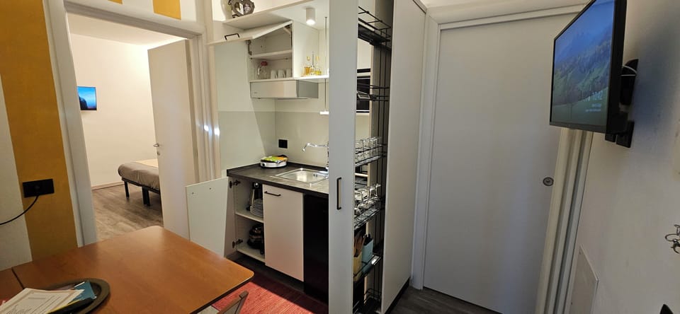 Quadruple Room, Multiple Beds, Patio, Courtyard View | Private kitchen | Mini-fridge, microwave, cookware/dishes/utensils