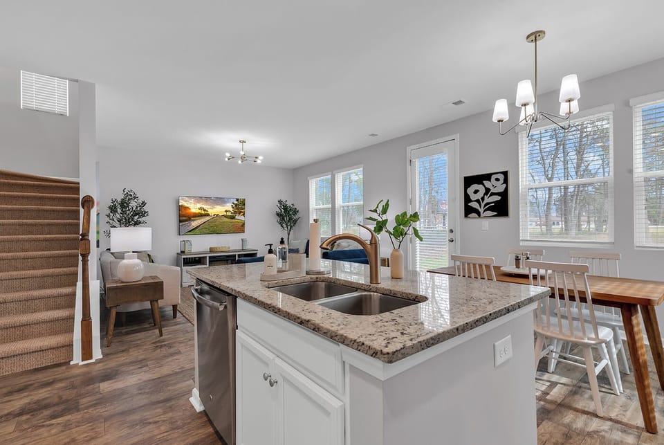 Open kitchen flows to living area, cook and connect without missing the fun