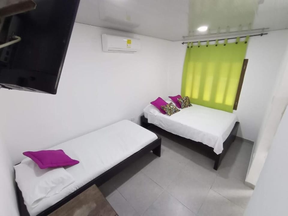 Deluxe Triple Room, Beach View | WiFi (free), bed sheets