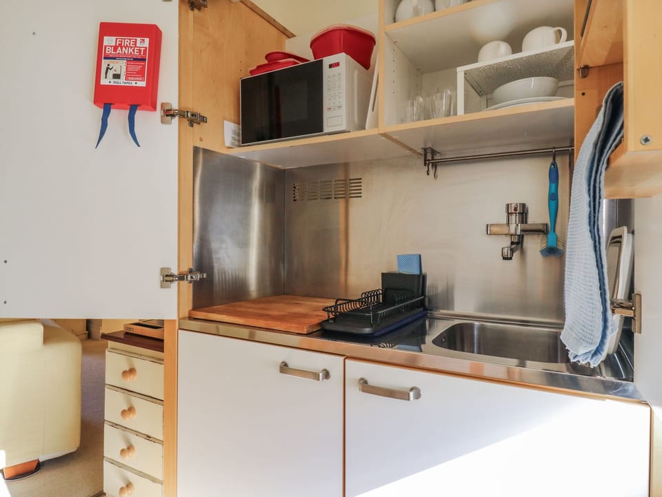 Fridge, microwave, toaster, cookware/dishes/utensils