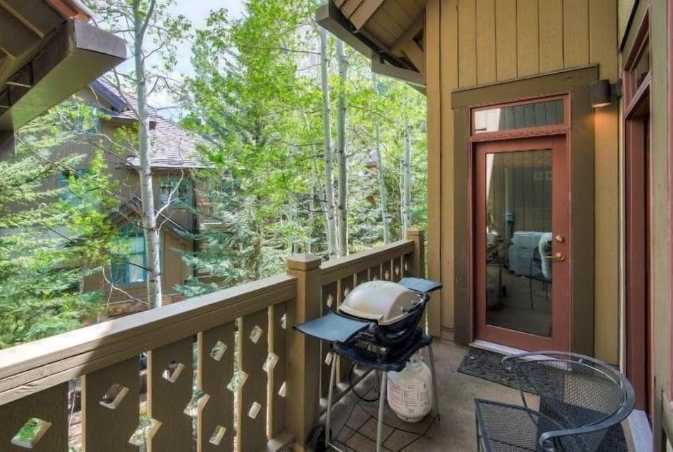 Mountain air and treetop views set the scene for moments of peace on a private balcony—perfect for morning coffee or evening unwinding.