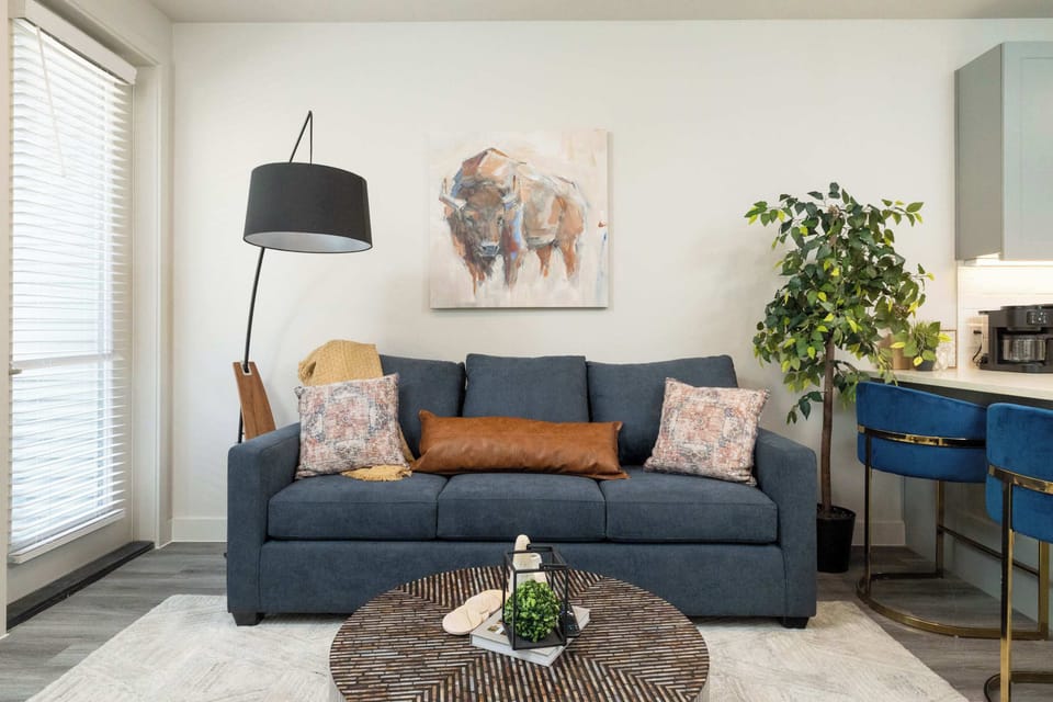 Inviting living room with a pull-out couch, a comfy chair and a flat-screen TV—perfect for relaxing or entertaining.