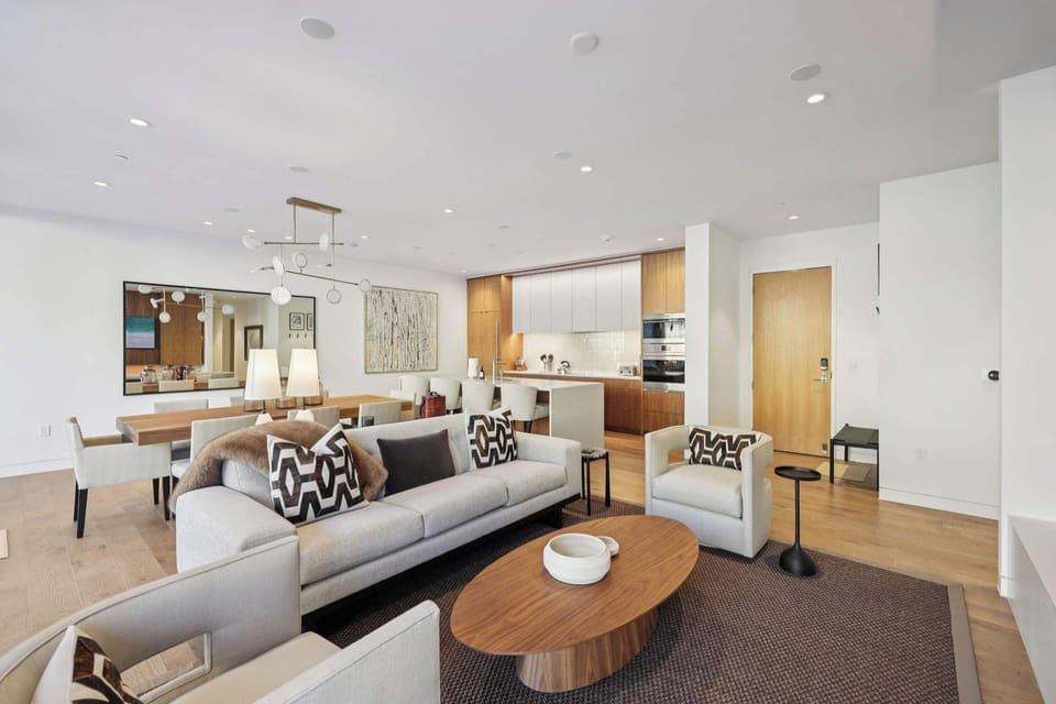 Relax in your modern open-concept living space with designer furnishings, sleek kitchen, and sophisticated style throughout.