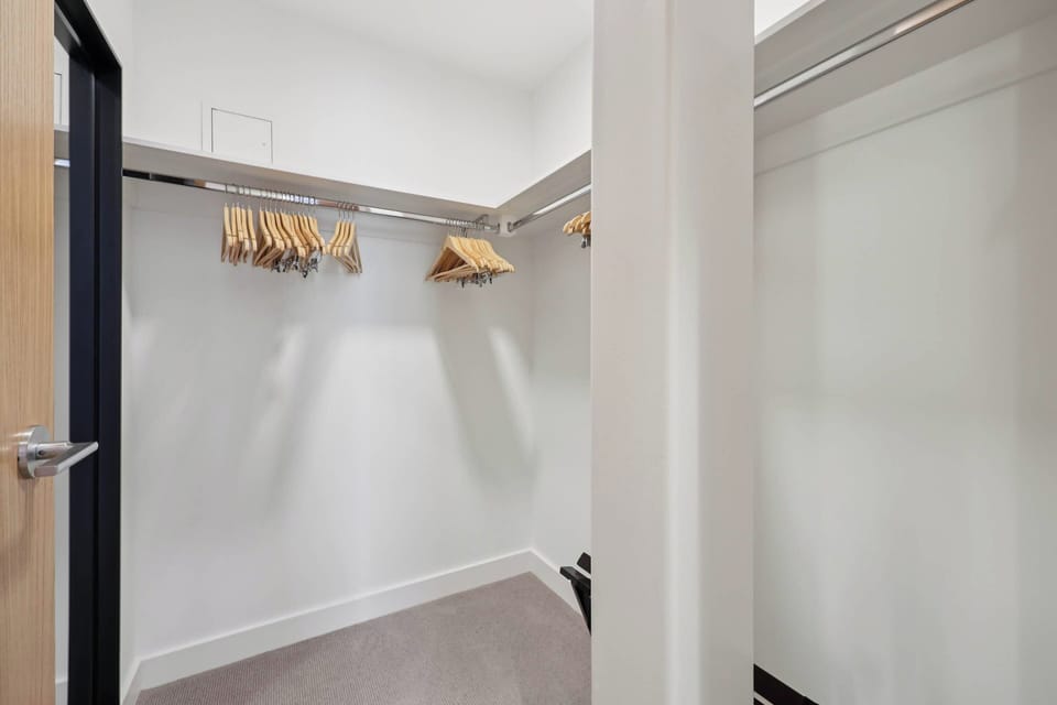 Your spacious walk-in closet offers ample hanging space and shelving to keep your belongings organized throughout your stay.