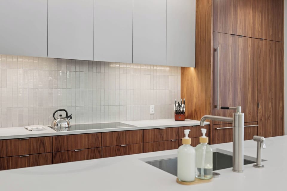 Your sleek kitchen features modern appliances and elegant finishes, perfect for preparing meals during your stay.