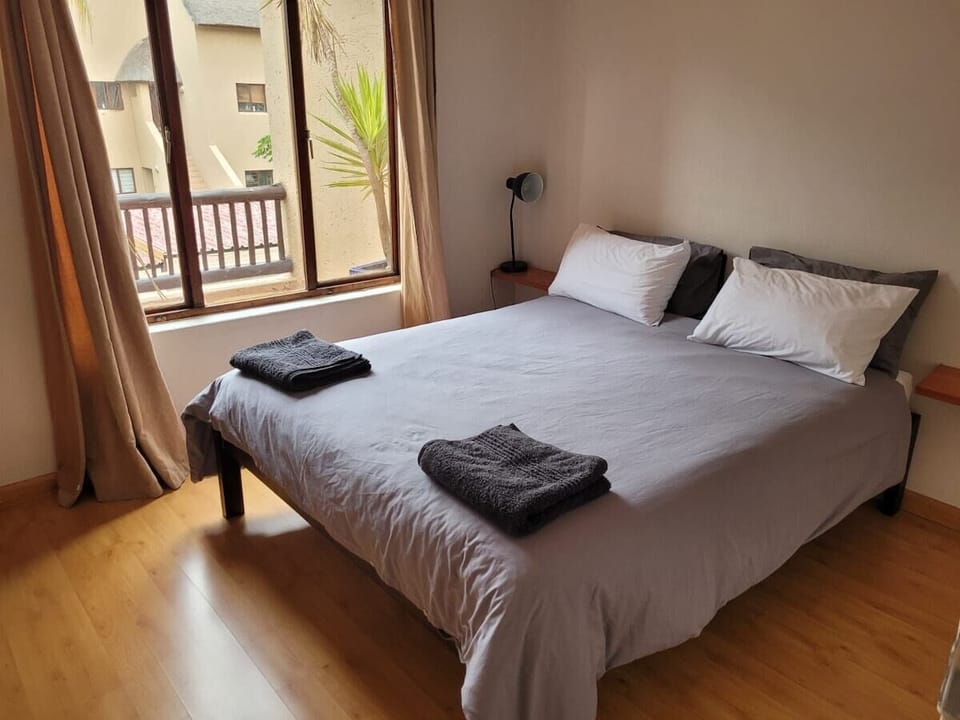 Main bedroom over-looking outdoor patio