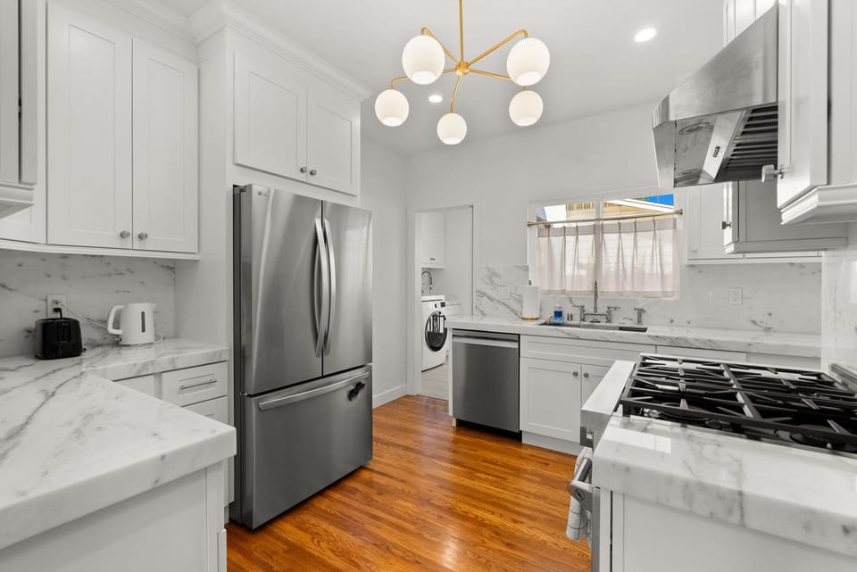 A modern kitchen fully outfitted with all you need to cook an amazing meal!