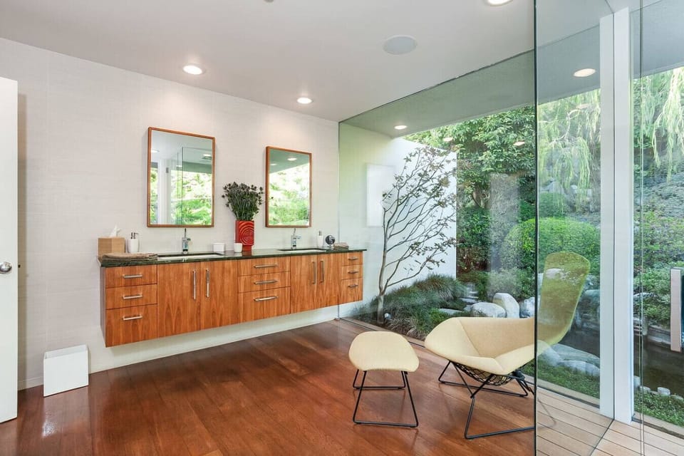Primary bathroom has a shower overlooking a beautiful, private Japanese garden.