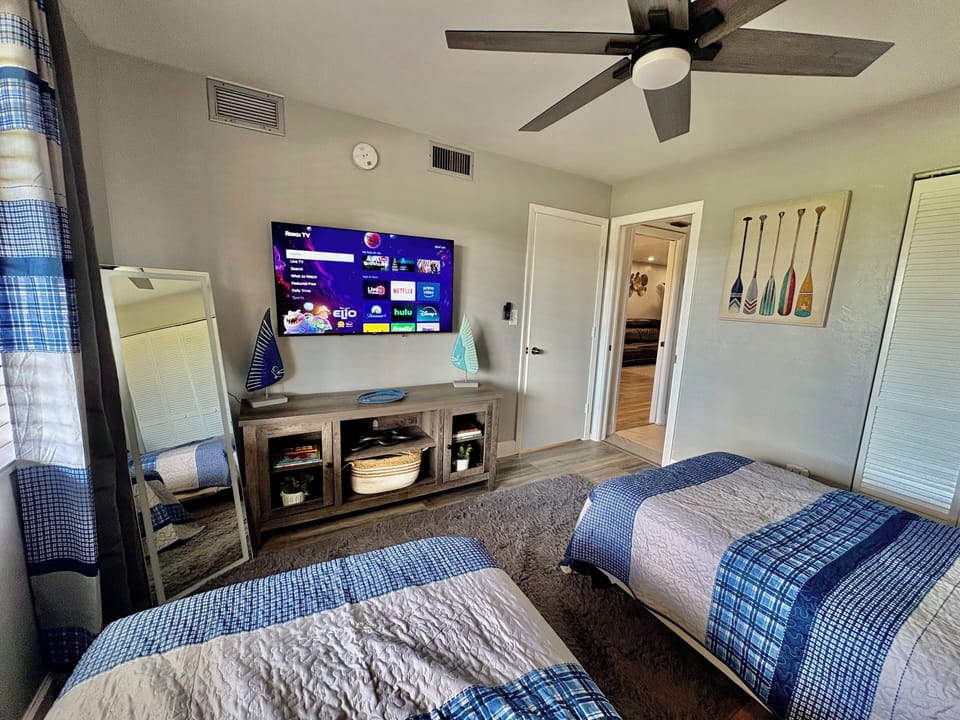 This comfortable bedroom features two twin beds, perfect for additional guests. 