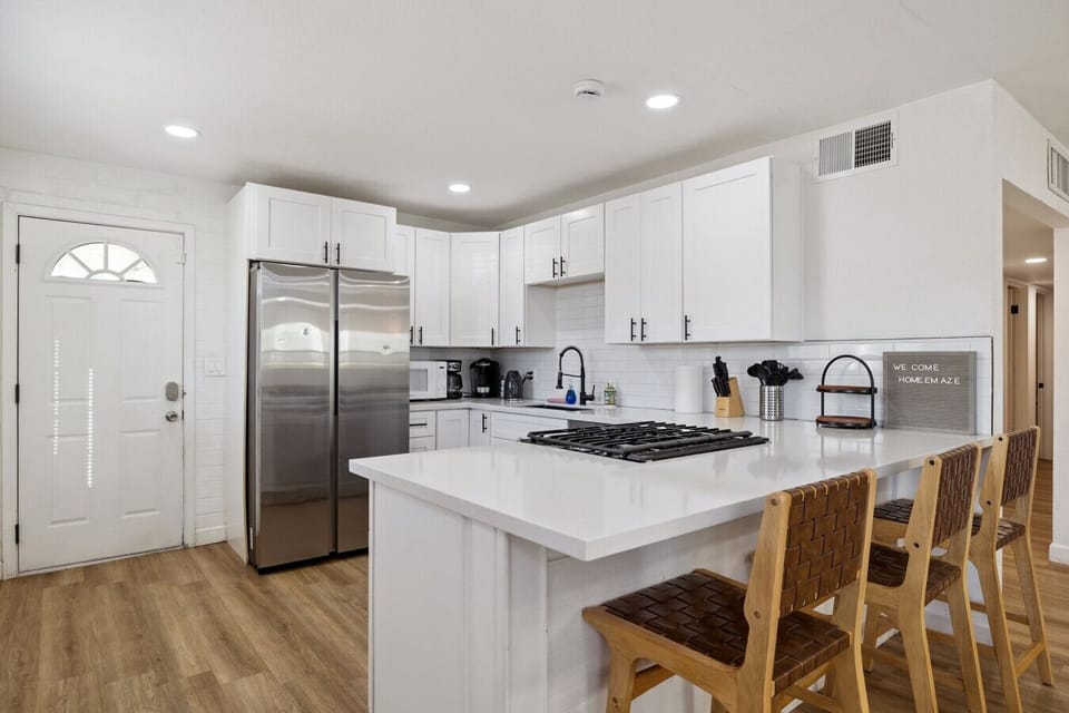 Kitchen with an island seating 2 people