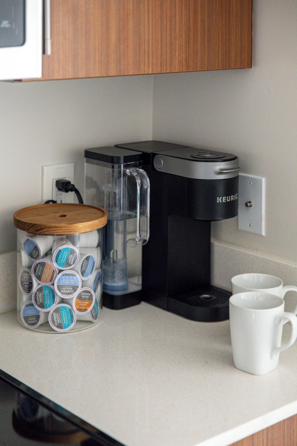 Keurig coffee station stocked w/ pods—brew a fresh cup anytime