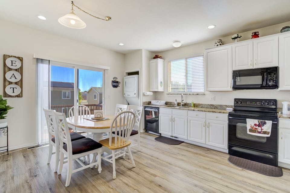 The open-concept design flows into the fully stocked kitchen